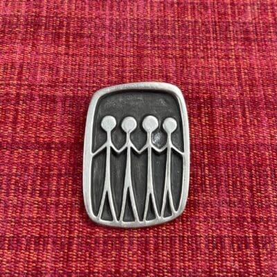 Tin brooch Four people Roland Landerholm